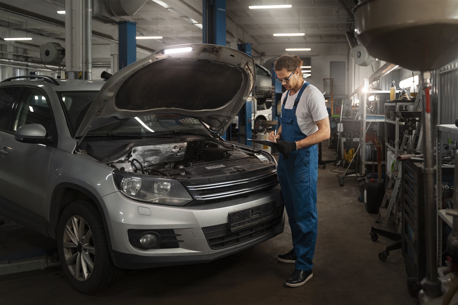 Mechanic working on a car in the workshop